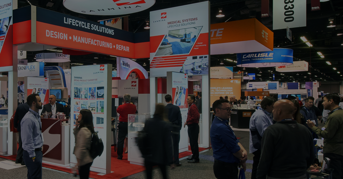 People exploring exhibits on expo floor