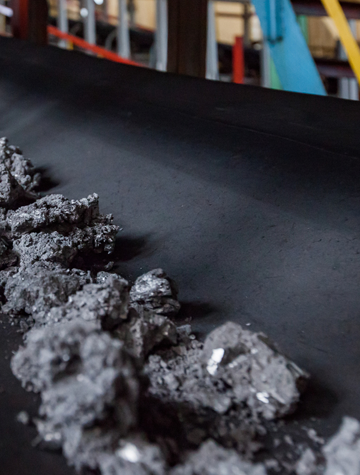 Black powders on conveyor belt