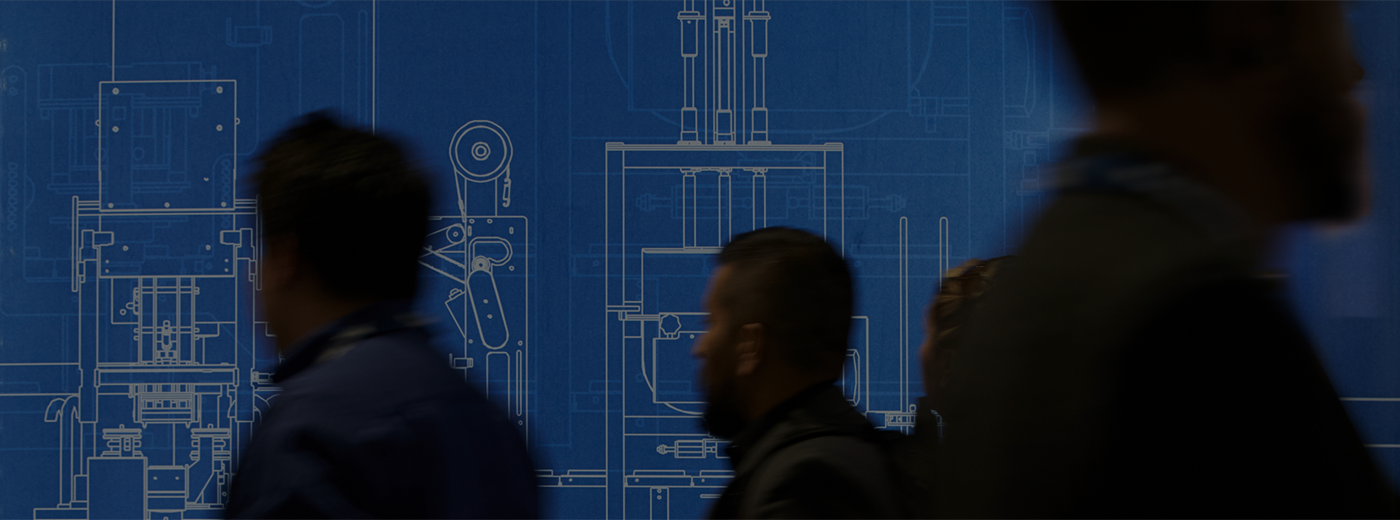 Crowd of people walking by a blue print of an invention