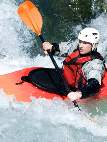 An active kayaker on the rough water