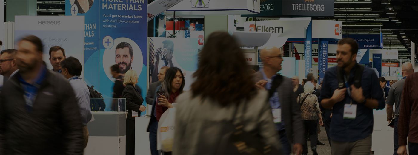 People exploring exhibits on expo floor