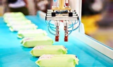 Packages being placed on conveyor belt