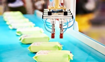 Packages being placed on conveyor belt