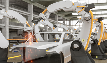 Robotics arms assembling an automobile