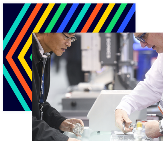 Two attendees examining a product in the expo hall floor