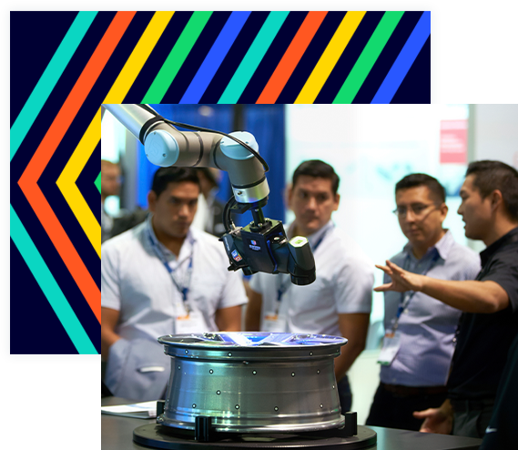 Men view robotic arm