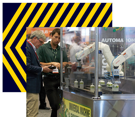 Two men watch robotic arms move bottles